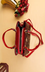 A structured handbag with a glossy red patent leather trim and handles, combined with a brown leopard print body, shown from a top-down view on a beige background with decorative red roses.