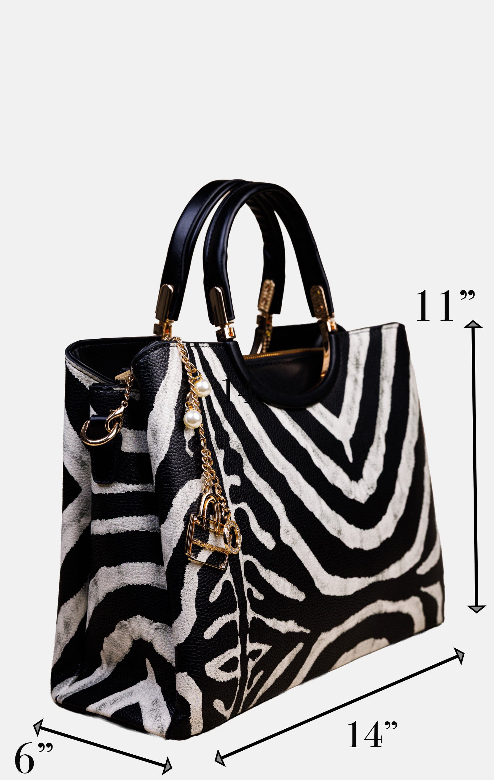 A zebra-print handbag with black leather handles and gold-tone hardware, shown with dimension arrows and labels indicating 11 inches tall, 14 inches wide, and 6 inches deep on a light gray background.