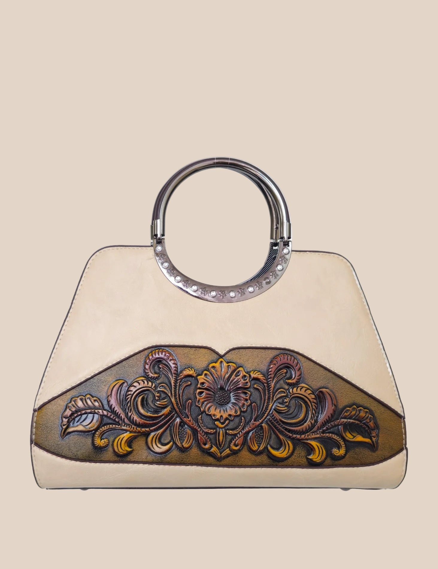 Light moca brown handbag with a floral tooled design front view