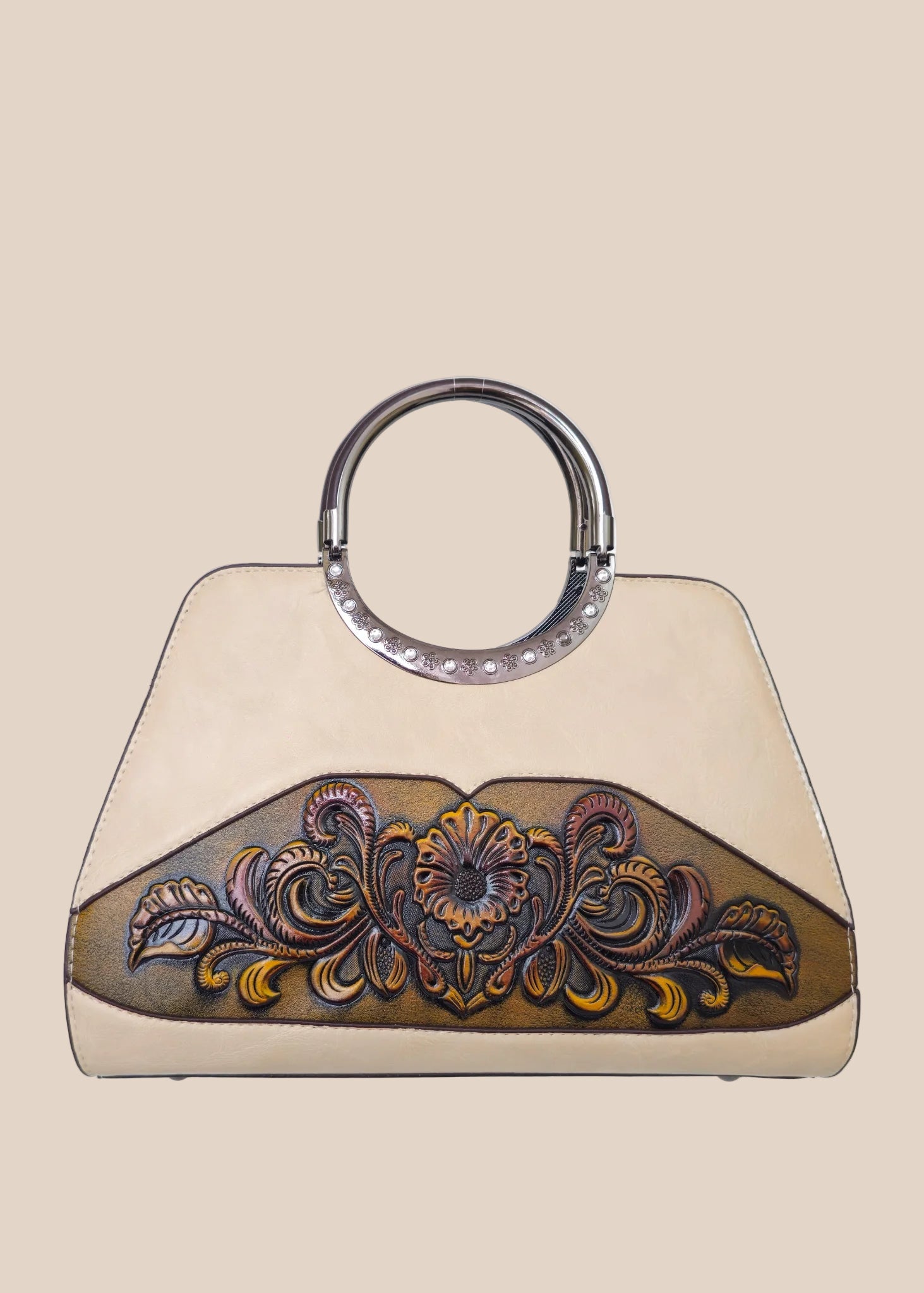 Light moca brown handbag with a floral tooled design front view