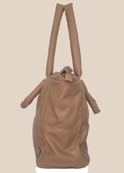 Brown smooth form handbag with a strap and handles side view