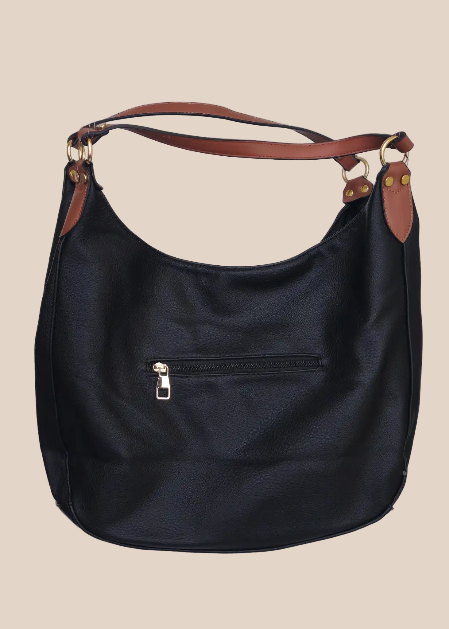 Black leather handbag with brown accents on a beige background back