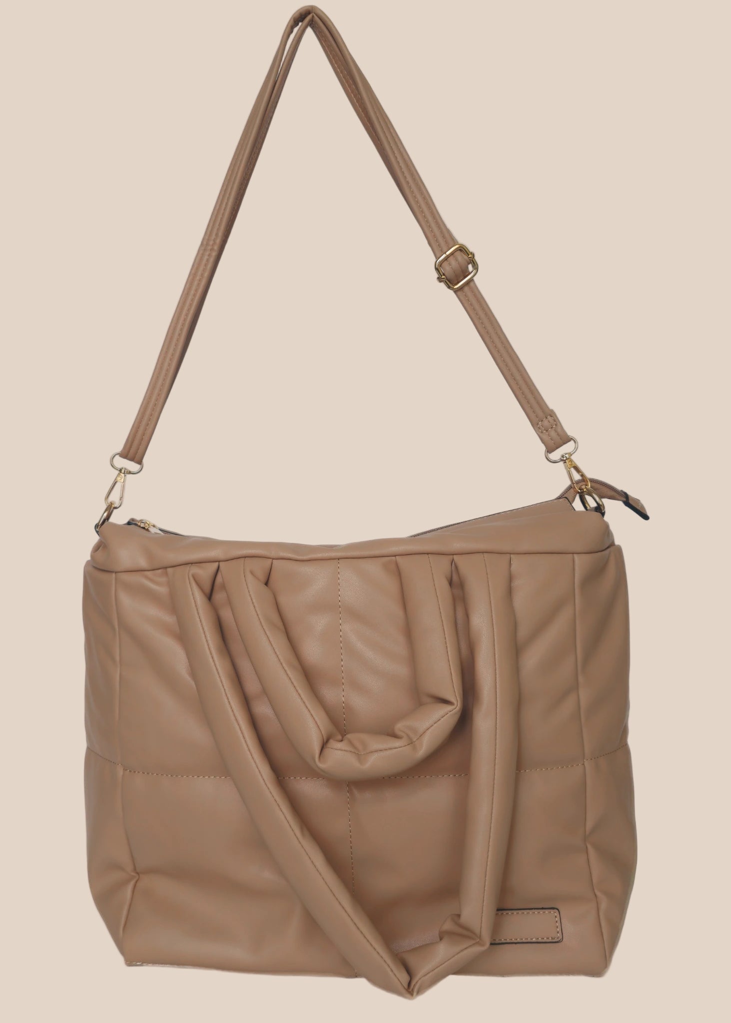 Brown smooth form handbag with a strap and handles front view