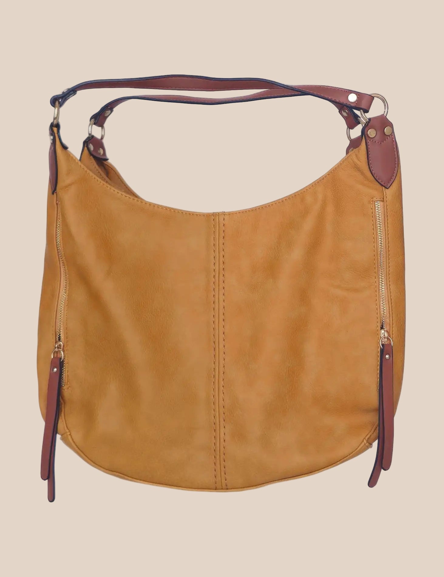 Brown leather handbag with purple accents on a beige background front