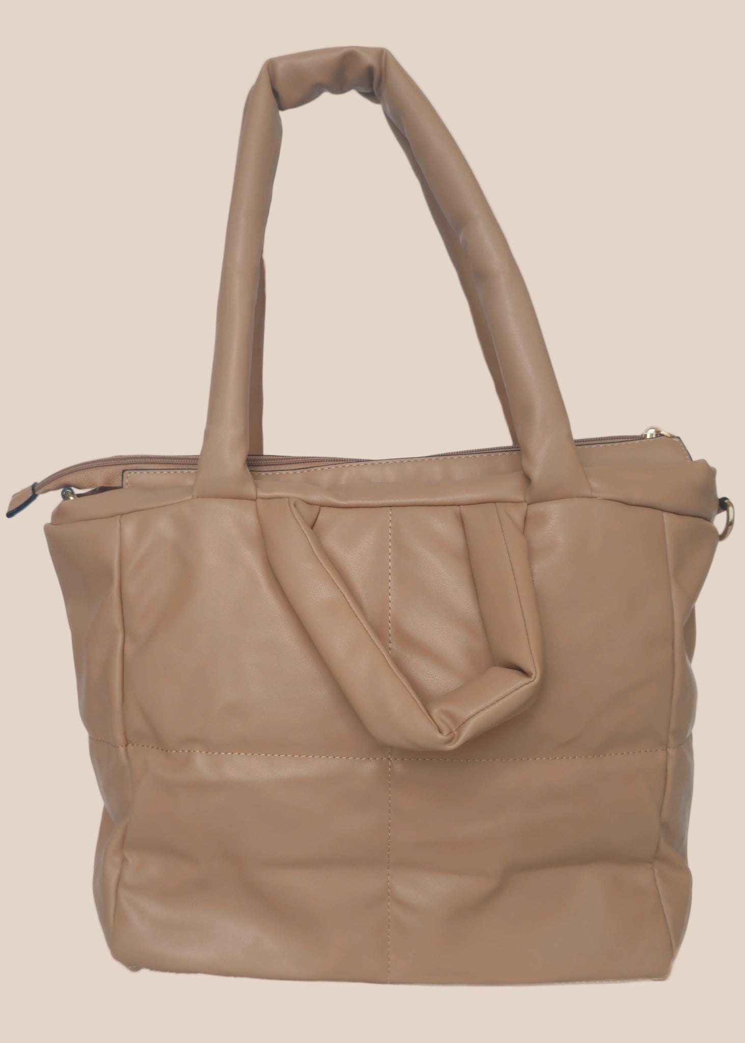 Brown smooth form handbag with a strap and handles back view