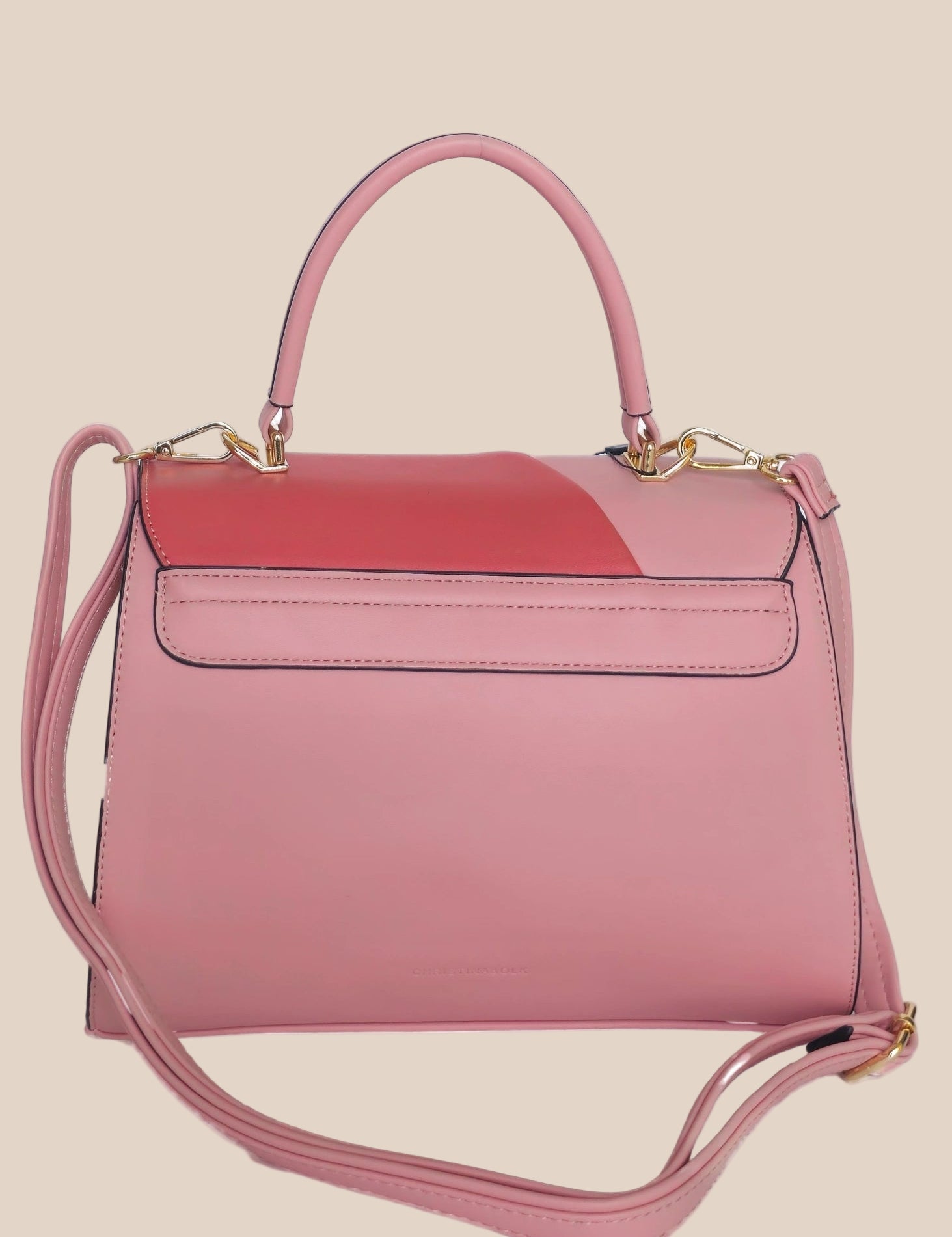 Pink and red handbag with a gold clasp back view