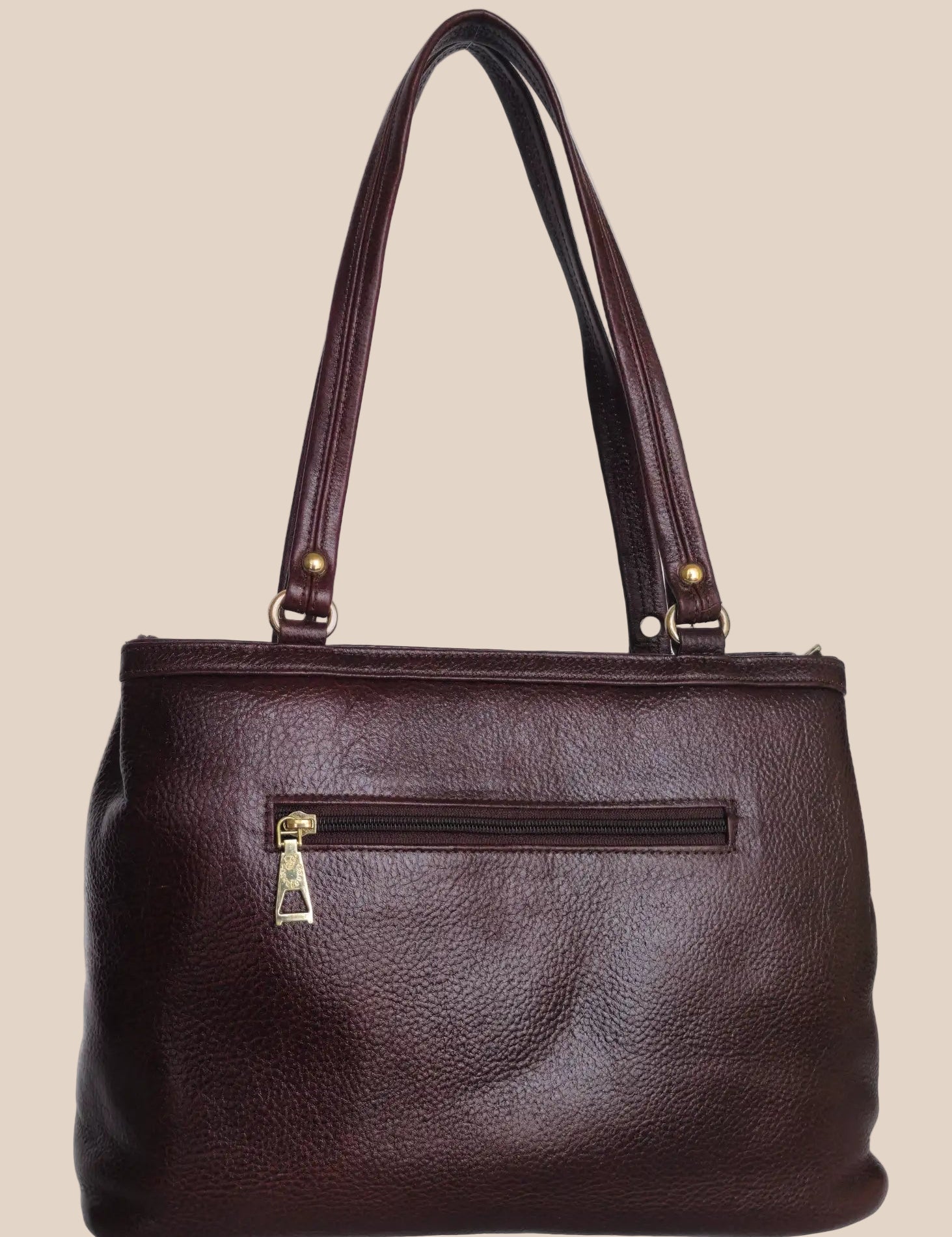 Burugundy leather handbag with gold accents back view