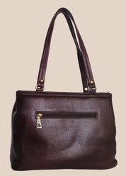Burugundy leather handbag with gold accents back view