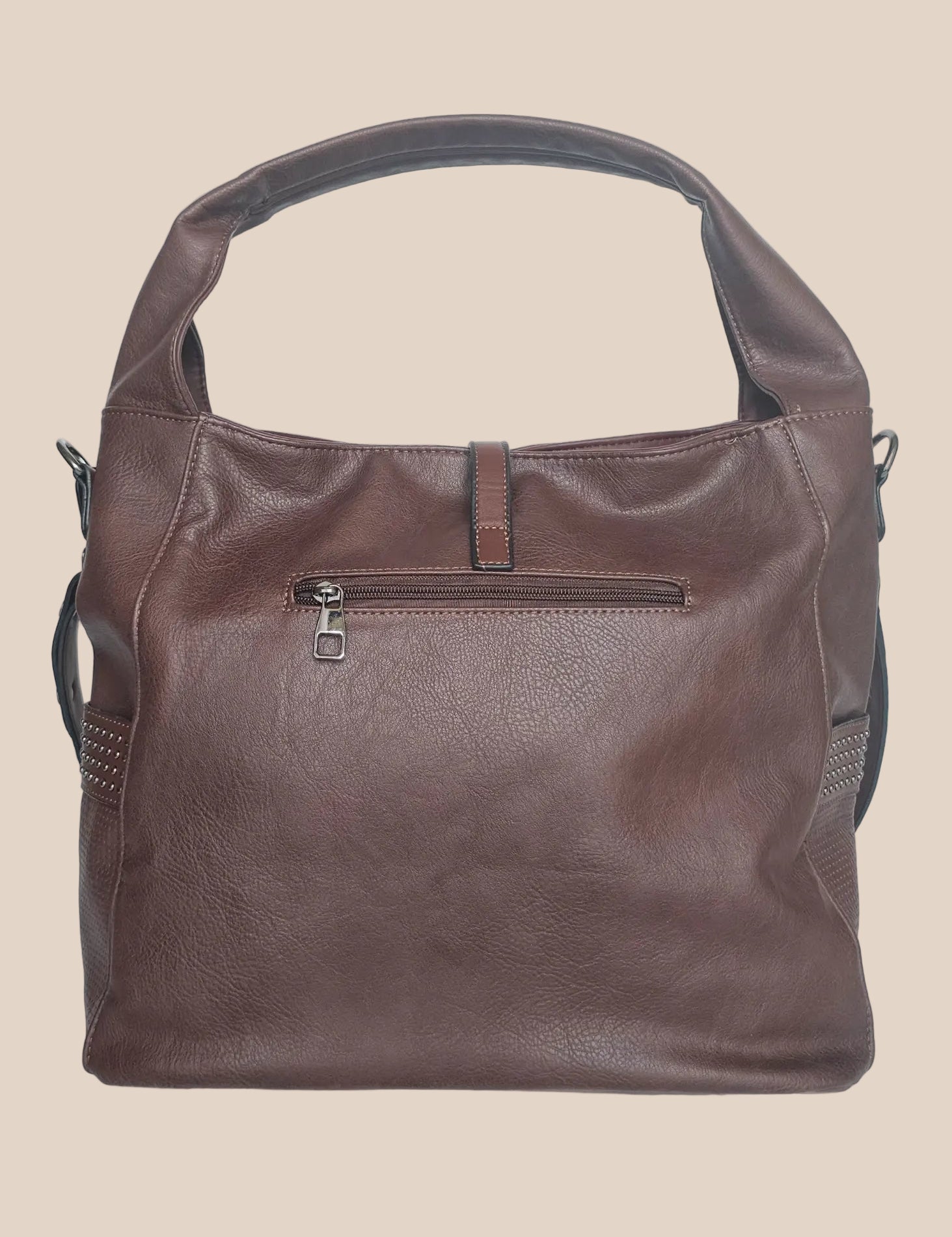 Brown leather handbag with a tassel on a beige background back view