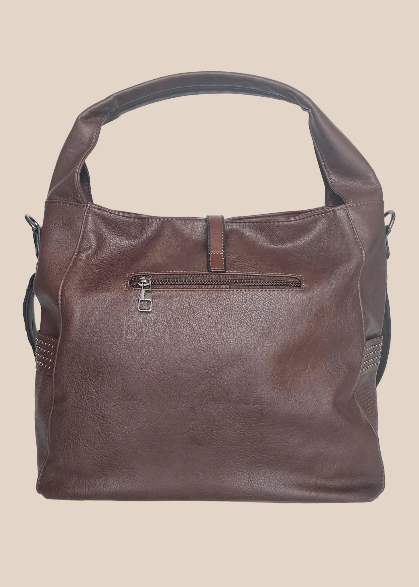 Brown leather handbag with a tassel on a beige background back view