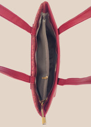Burugundy floral-patterned handbag with a gold zipper interior view