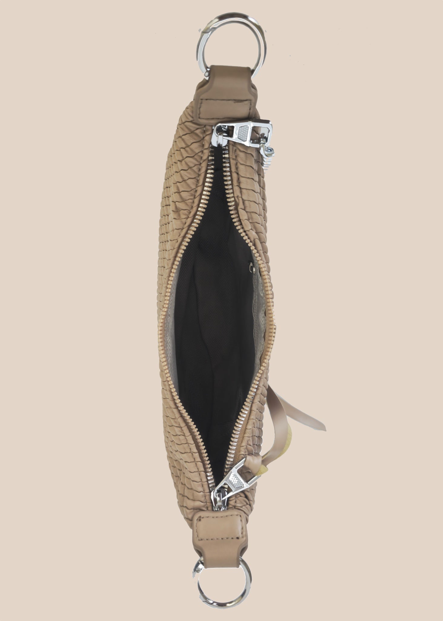 Beige leather handbag with a zipper top view
