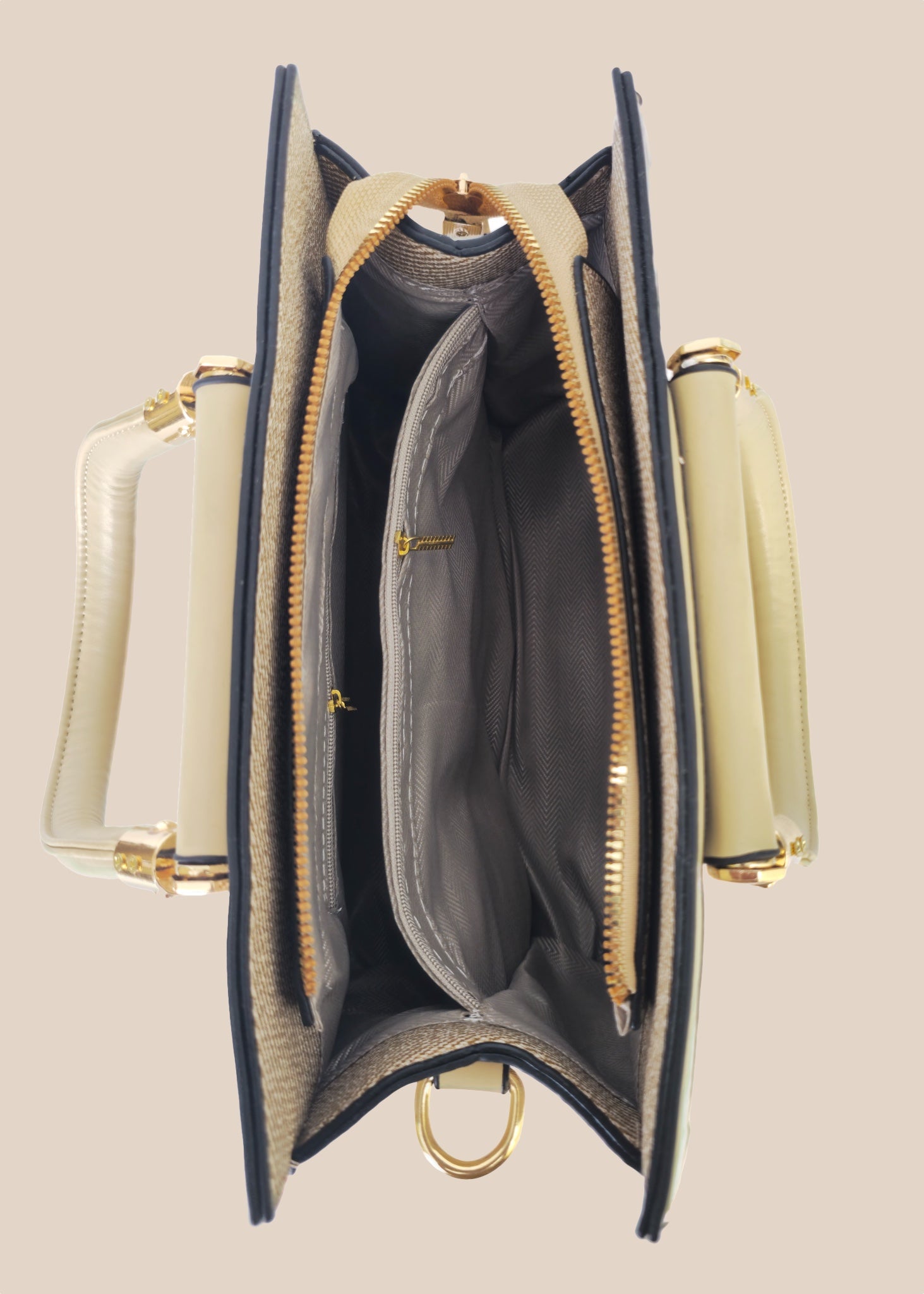 Open handbag with beige interior and gold accents top view