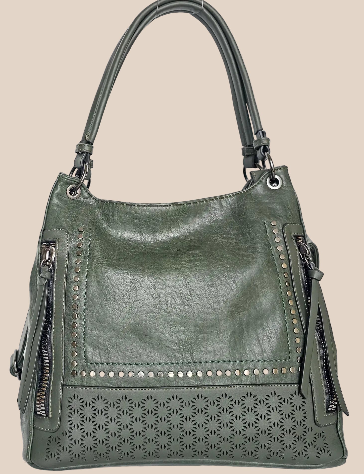 Green handbag with decorative studs and cut-out patterns front view