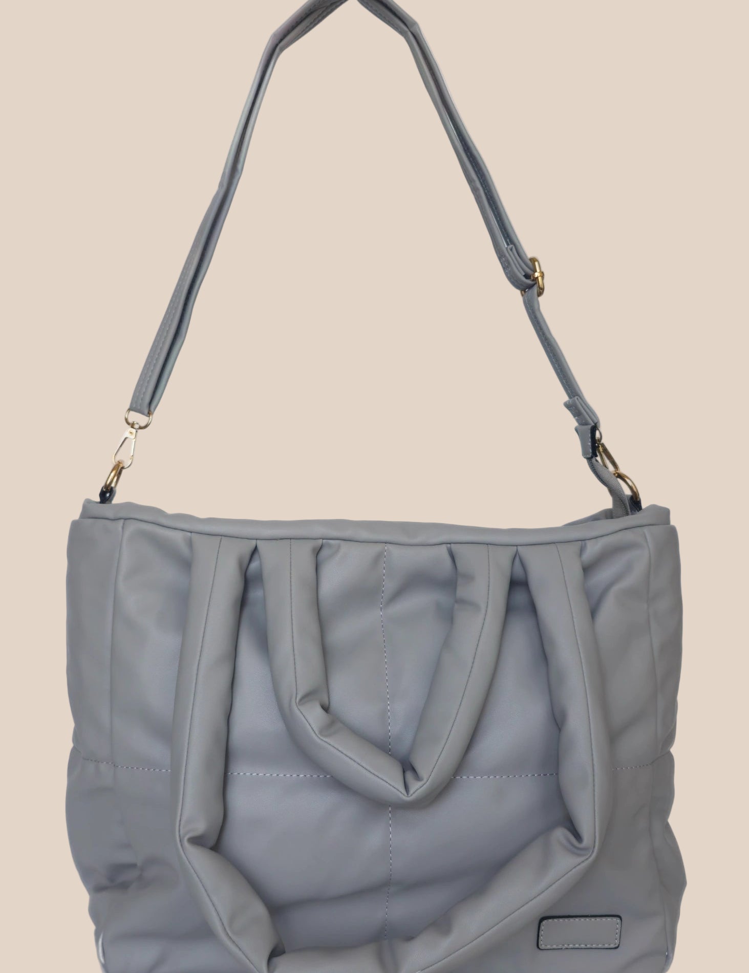 Gray smooth form handbag with a strap and handles front view