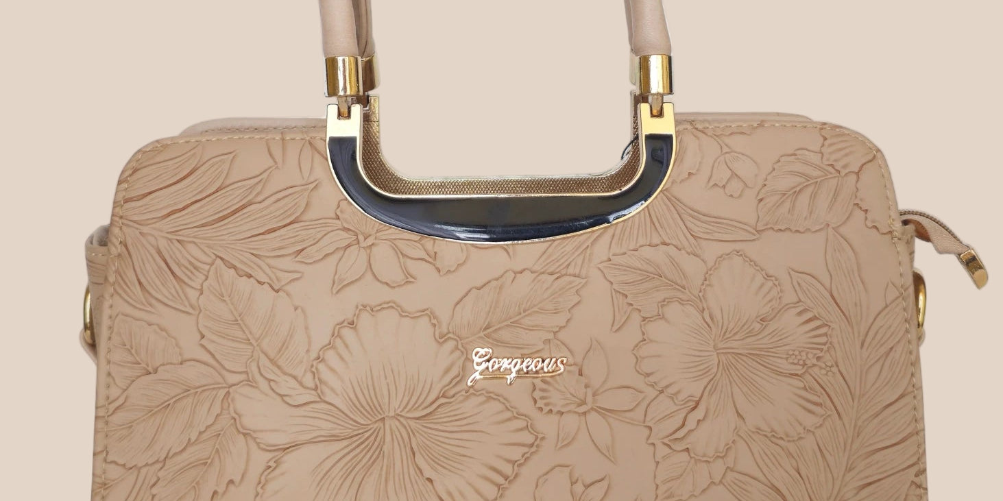 Beige handbag with a floral pattern and a gold handle front view
