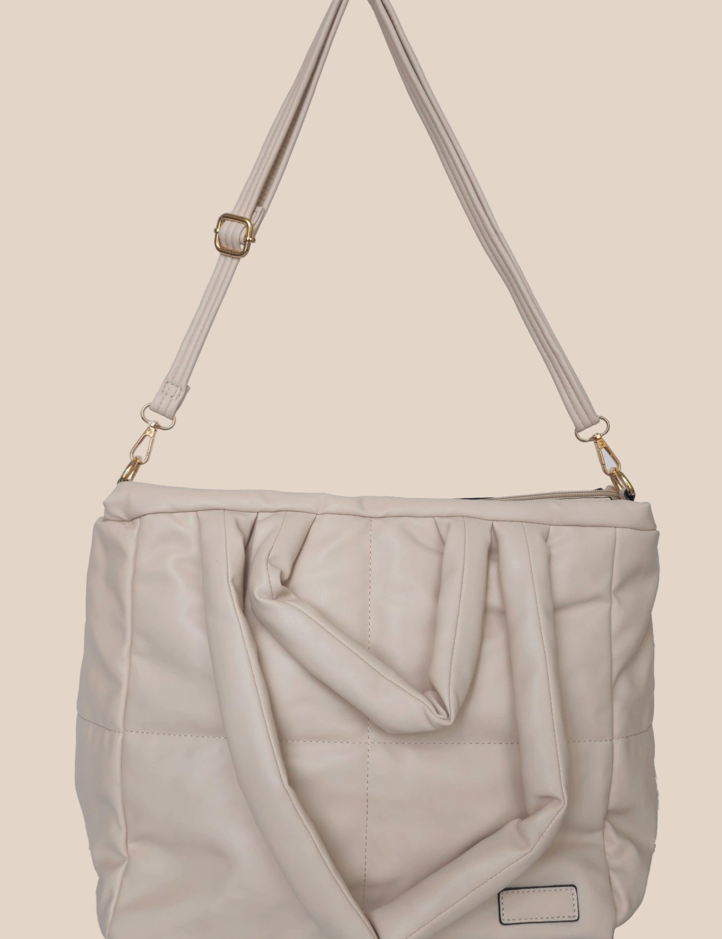 Light Gray smooth form handbag with a strap and handles front view