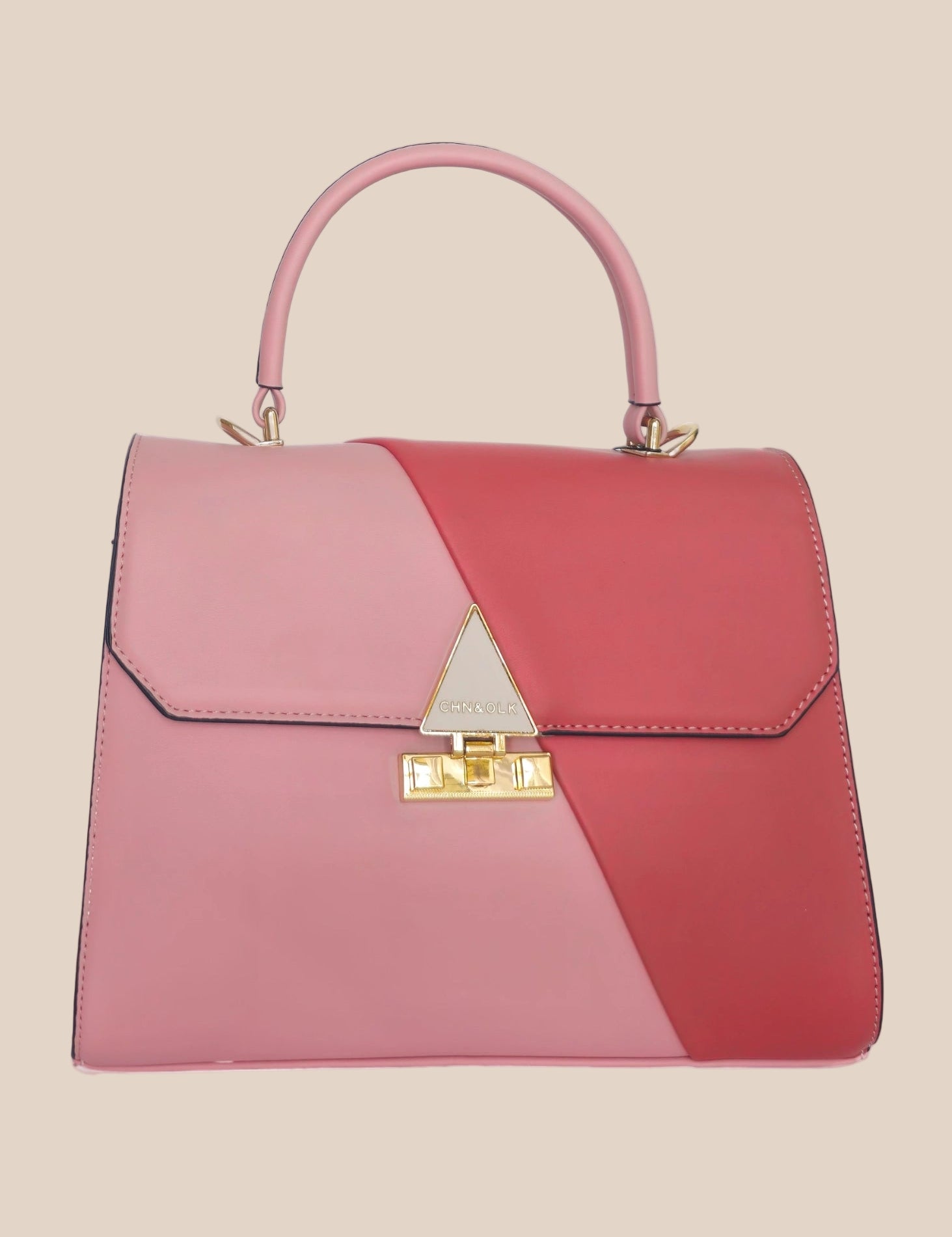 Pink and red handbag with a gold clasp, front view