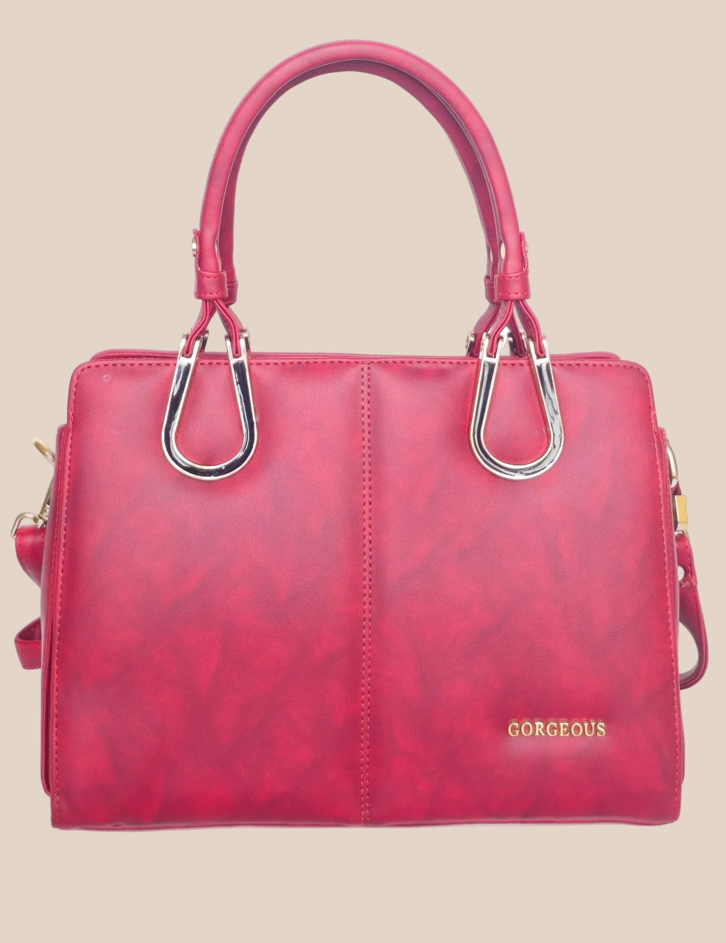 Dusty pink handbag with gold accents front view