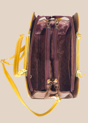 Purple handbag with yellow strap inside view
