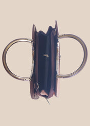 Dark mouve party handbag with floral embossing, top view