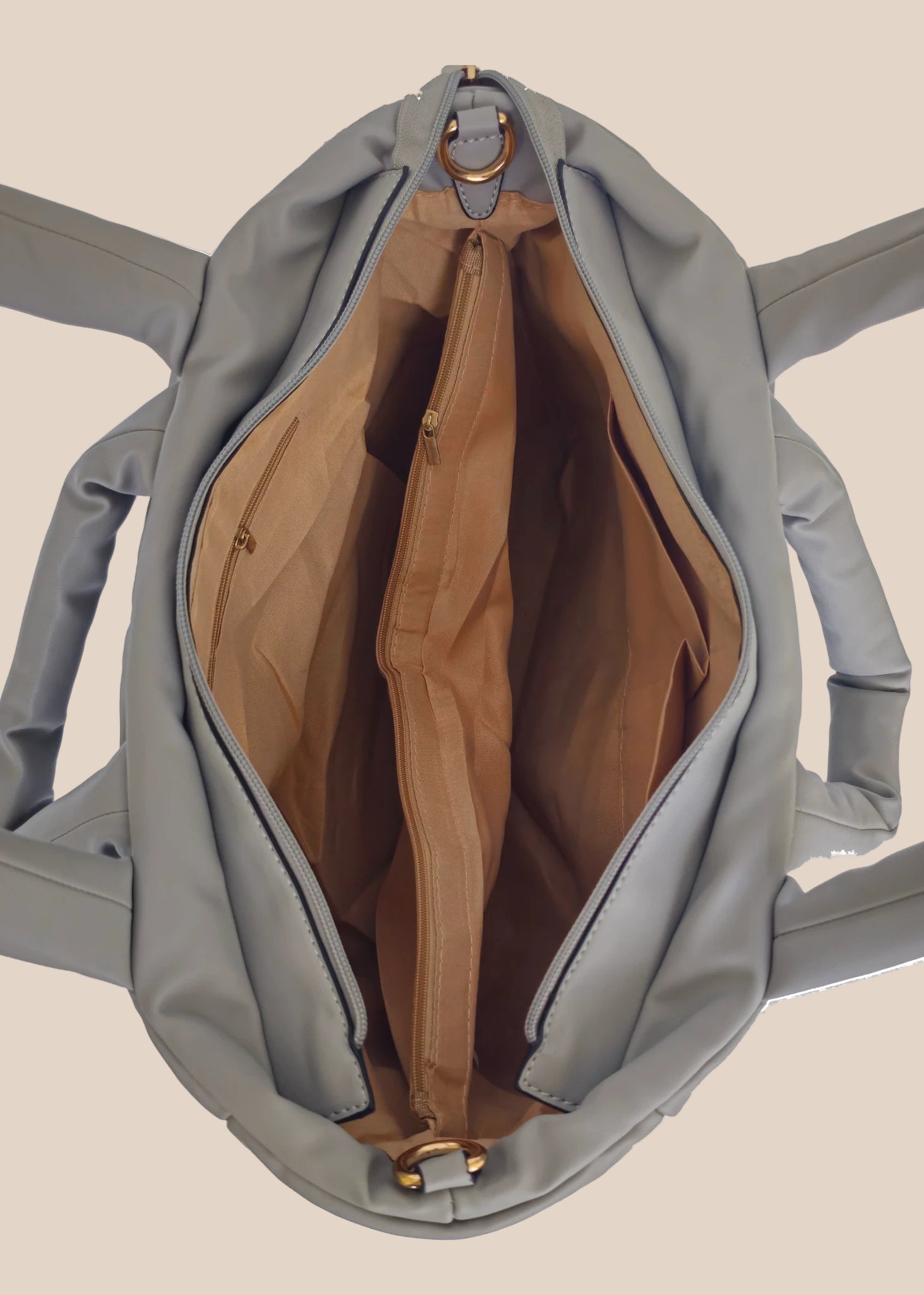 Gray smooth form handbag with a strap and handles inside view