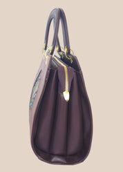Brown party handbag with a colourful art side view