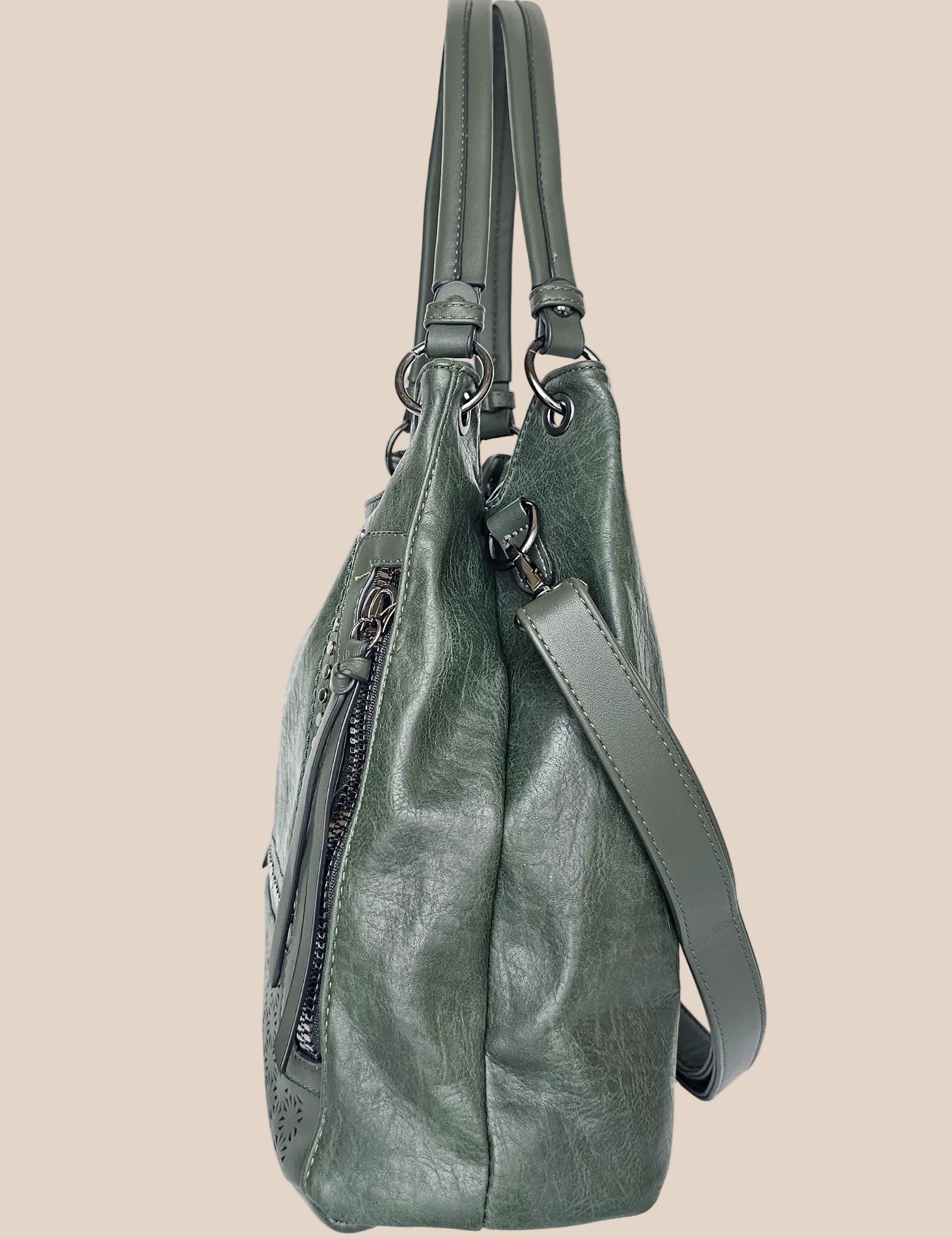 Beige handbag with a floral pattern and a gold handle side view