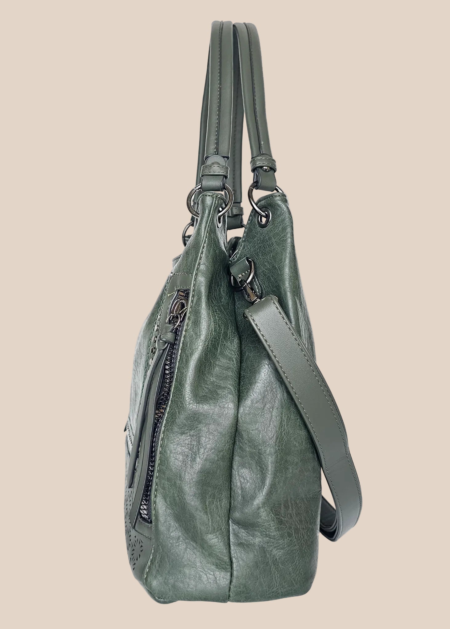 Beige handbag with a floral pattern and a gold handle side view