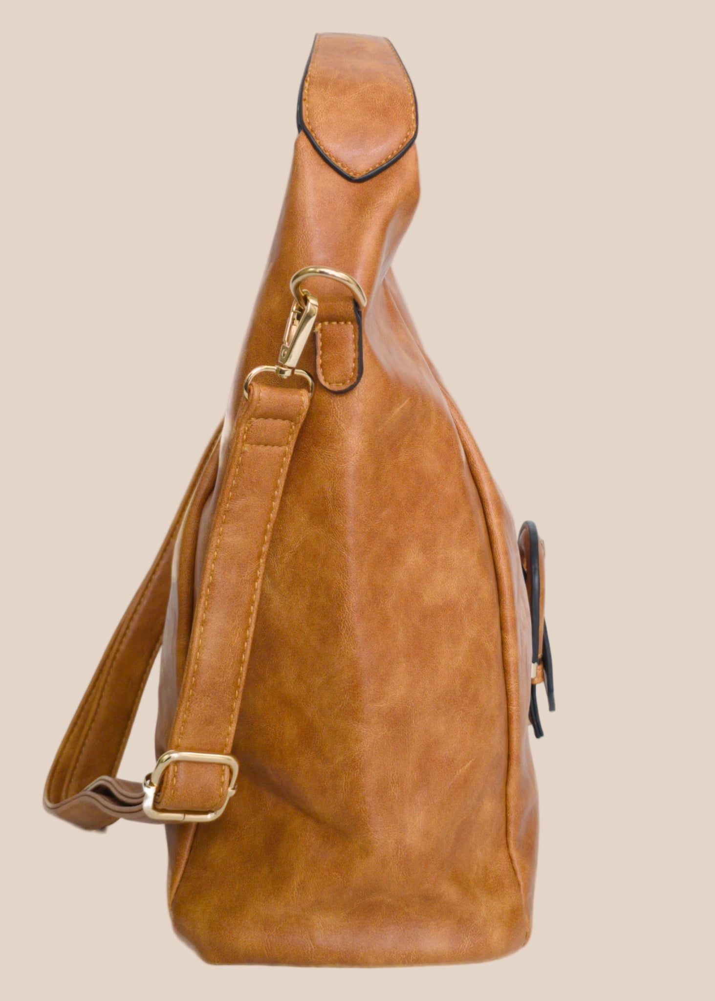 Brown leather handbag with a buckle detail side view
