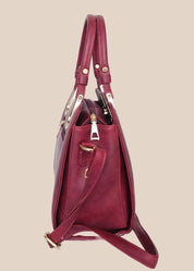 Dusty pink handbag with gold accents side view