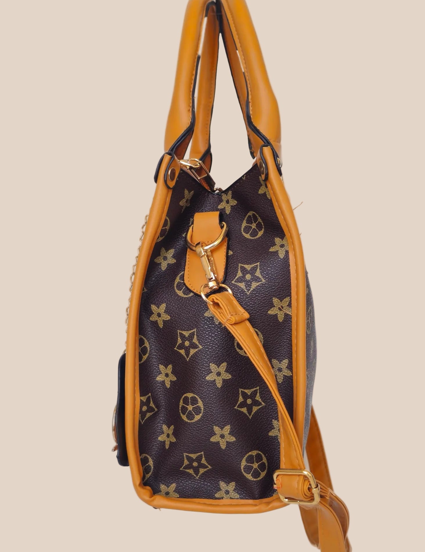 Handbag with a star pattern and a brown handle side view