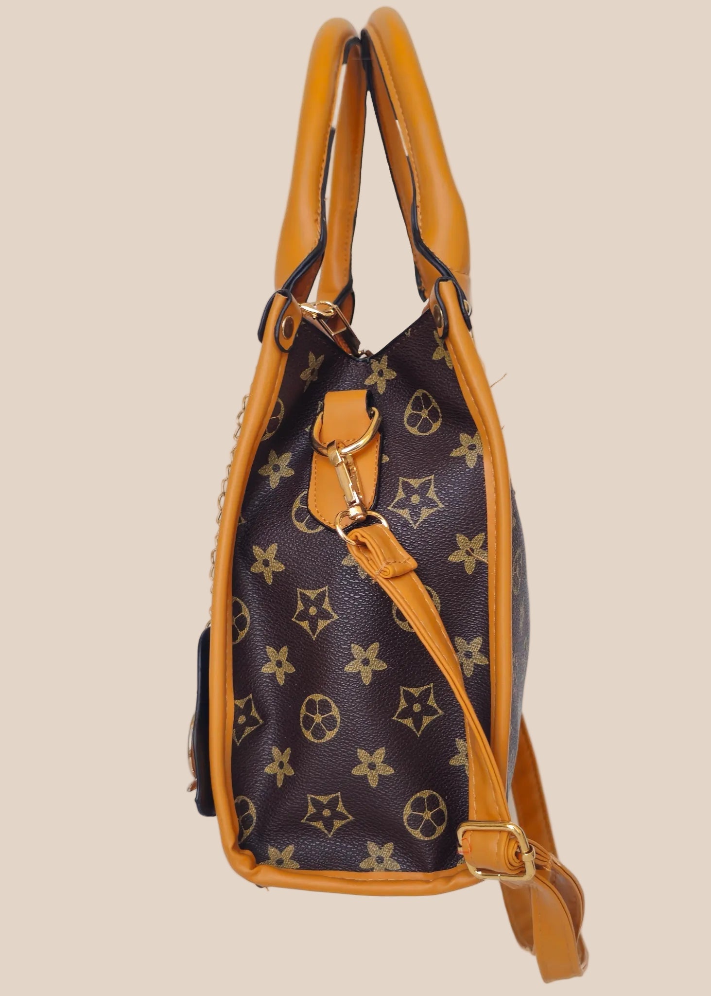 Handbag with a star pattern and a brown handle side view