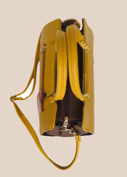 Yellow handbag with a strap top view