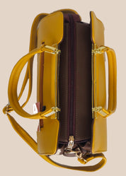 Yellow handbag with gold handles side view