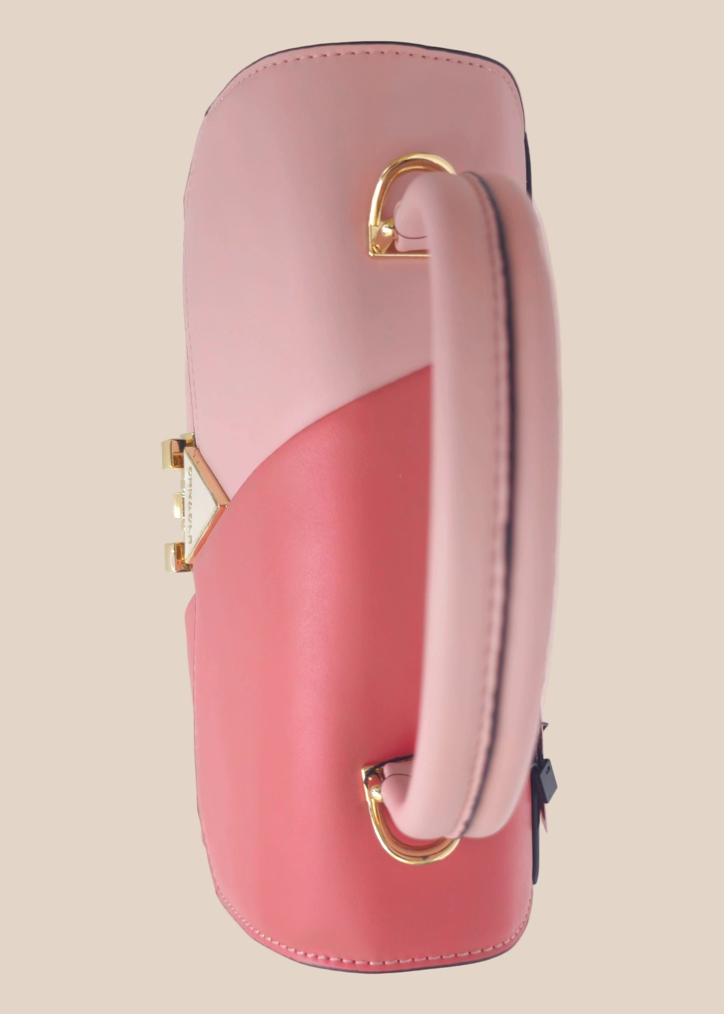 Pink and red handbag with a gold clasp top view