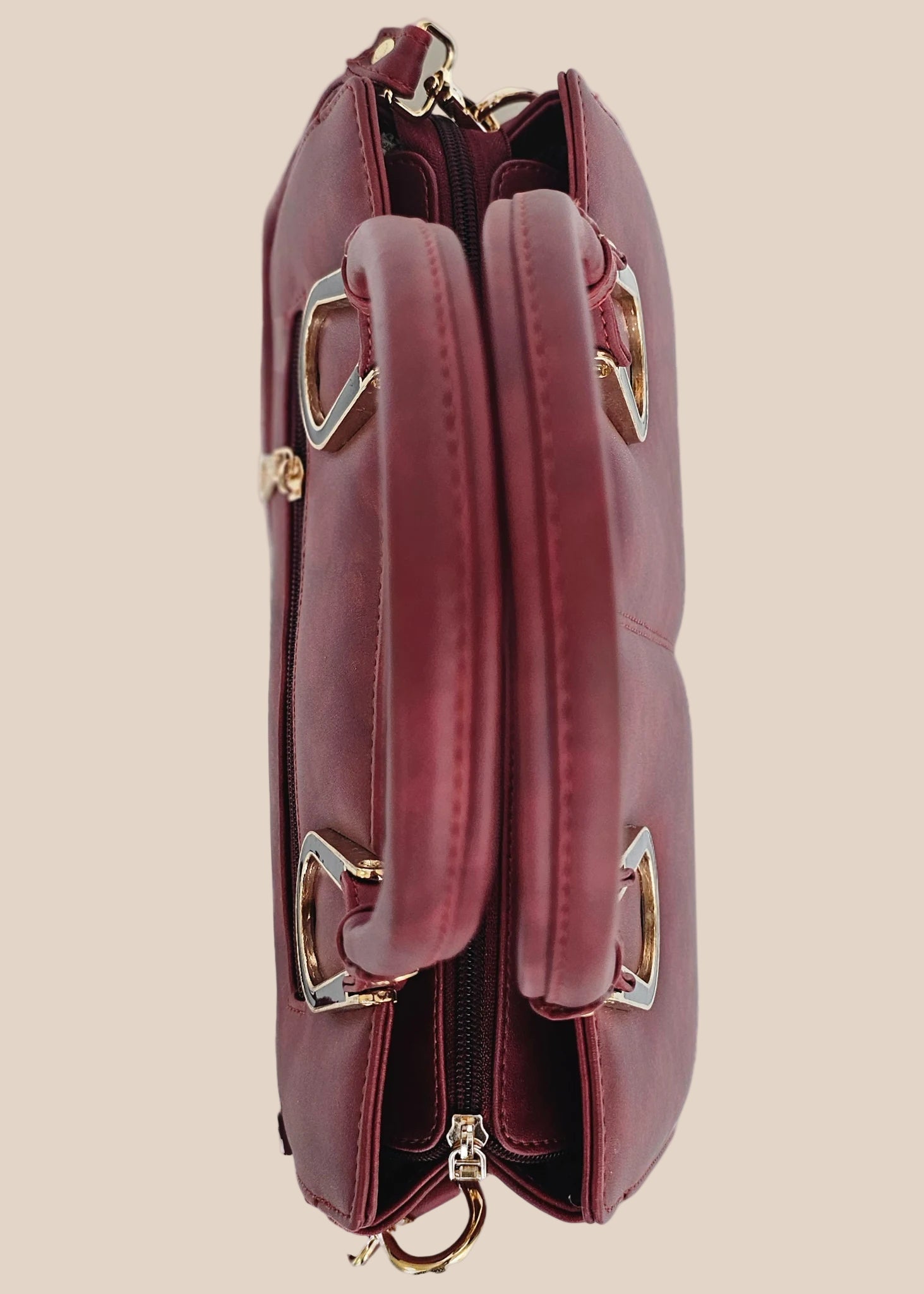 Dusty pink handbag with gold accents top view