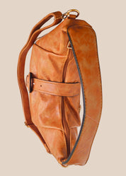 Brown leather handbag with a buckle detail top view