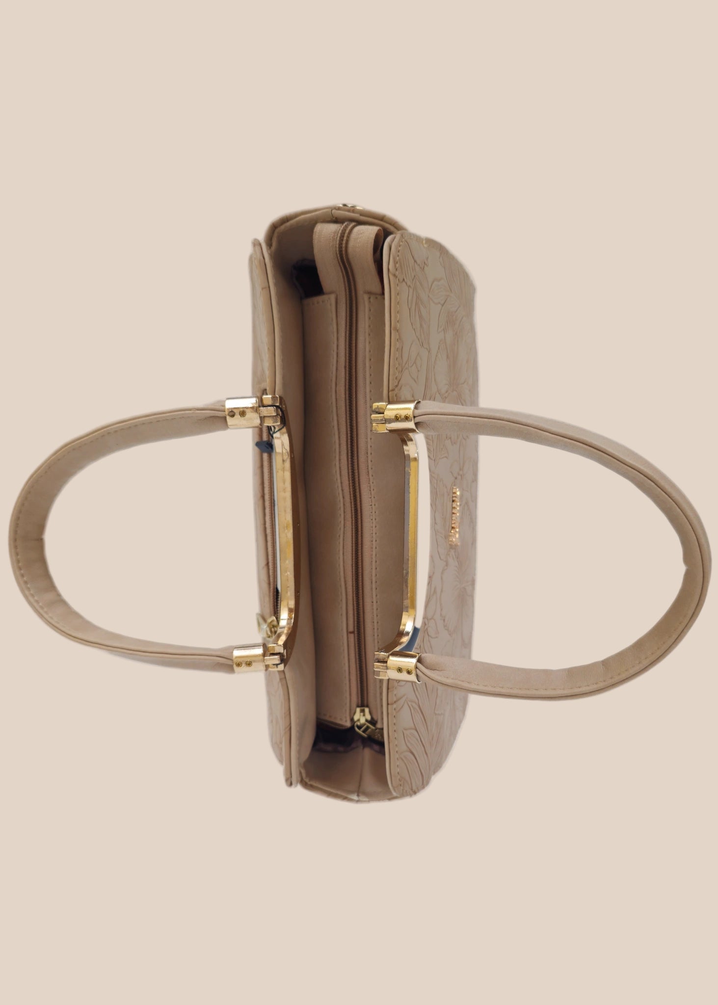 Beige handbag with a floral pattern and a gold handle top view