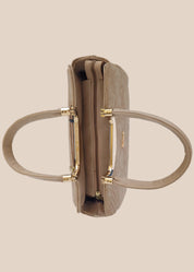 Beige handbag with a floral pattern and a gold handle top view