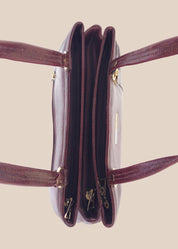 Burugundy leather handbag with gold accents top view