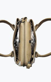 A top-down view of a beige leather handbag with a double zipper closure and a patterned gray and white interior lining, shown on a plain white background.